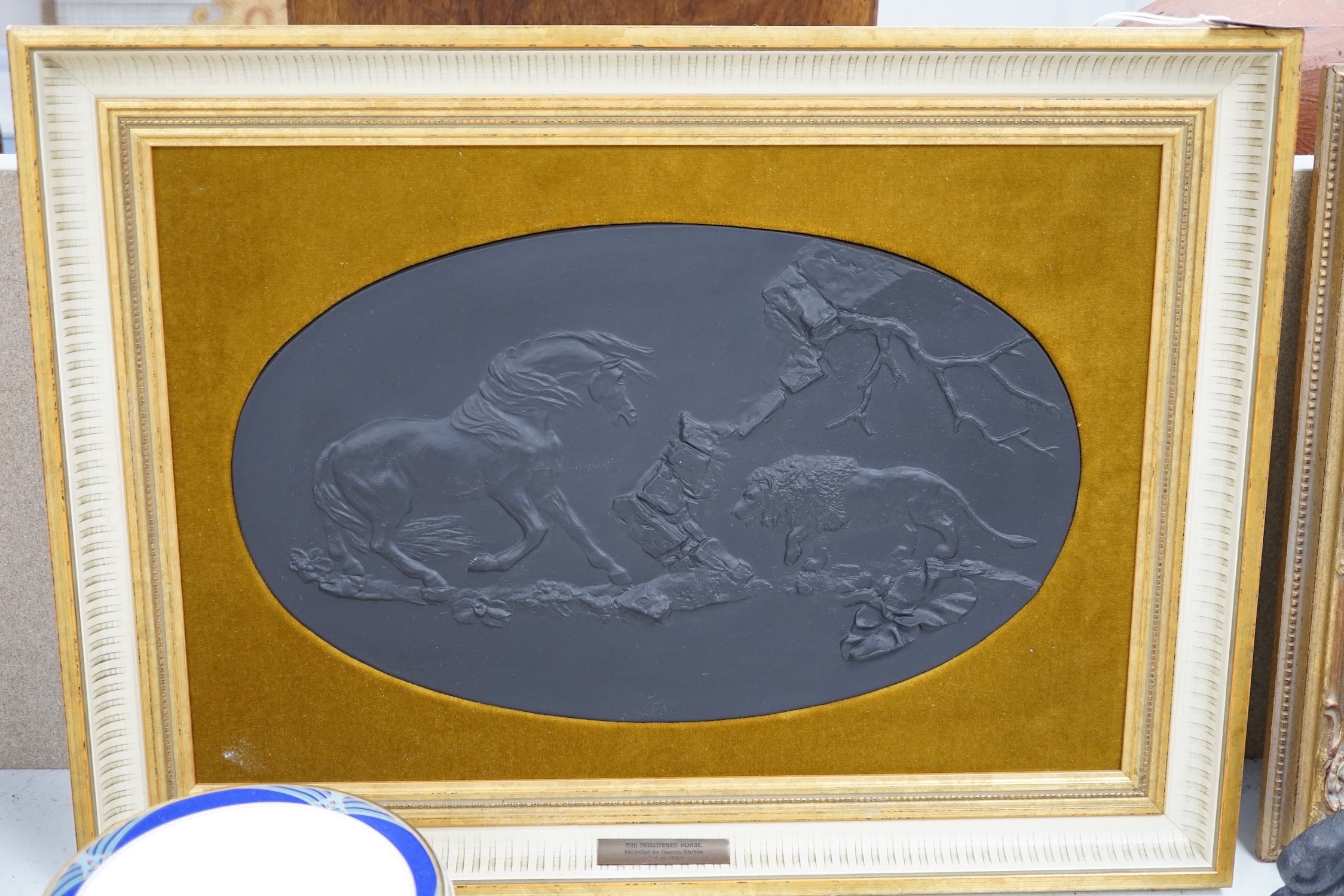 A framed oval Wedgwood black basalt plaque, “ The Frightened Horse”, limited edition 98/250, 39cms wide